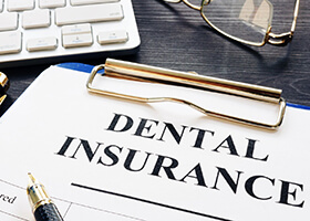 Dental insurance paperwork for the cost of dental implants in Rochester
